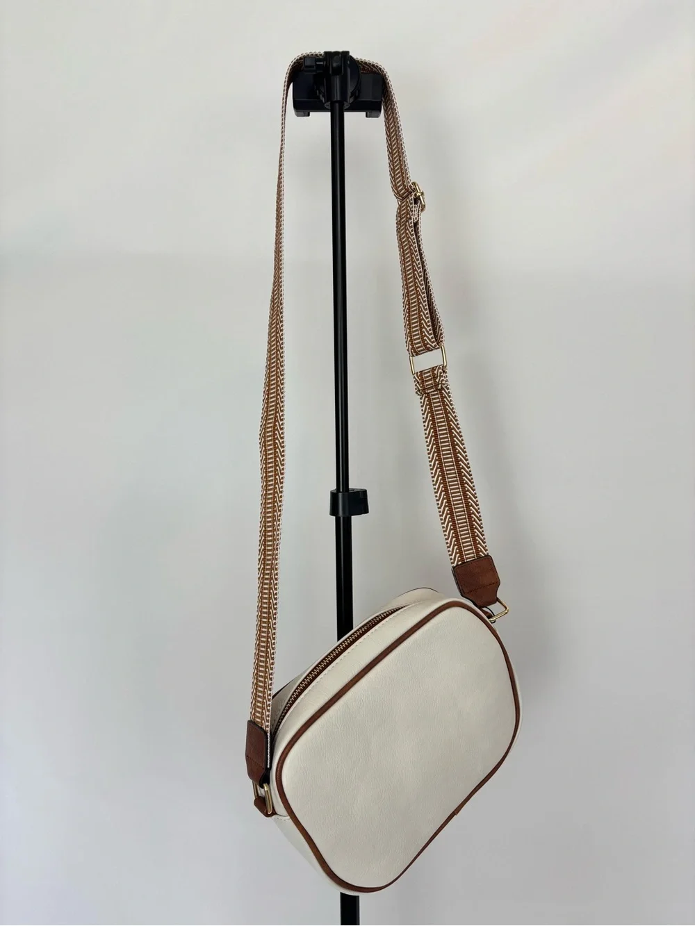 Cream Crossbody Bag with Tan Trim and Adjustable Strap
